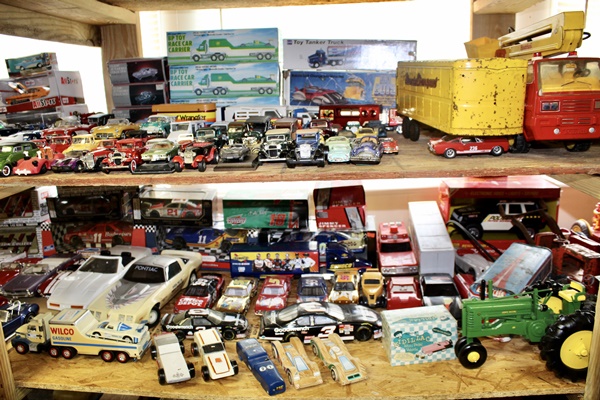 Hand-Carved Wooden Tractor (Lynn Newenshwander), Trans Am Decanter, Plastic Corvette, Smaller Die Cast and Toy Cars, NASCAR Memorabilia, Pine Wood Derby Cars