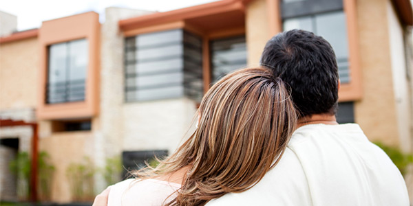 couple admiring their new house